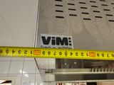 a measuring tape on the wall of a kitchen
