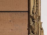 a picture of a picture of a gold frame on a wall