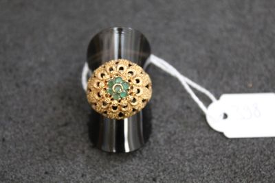 a close up of a ring on a table with a price tag
