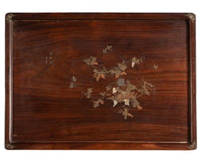 an image of a wooden tray with flowers and leaves on it