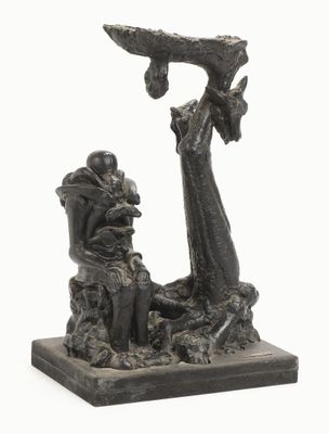 statue représentant un homme et une femme assis sur un banc, avec un oiseau en vol