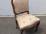 two chairs sitting next to each other on the street