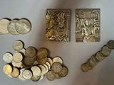 a lot of coins that are sitting on a table
