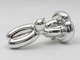 pair of chrome plated butt plugs on a white background