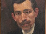 portrait of a man with a mustache in a black suit and bow tie