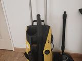 two yellow and black vacuum cleaners sitting on the floor next to each other