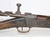 an old gun with a wooden barrel and a metal handle