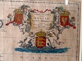 an old map with a picture of a coat of arms on it