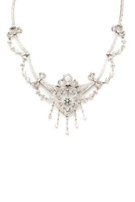 a close up of a necklace on a white background