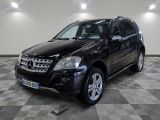 a picture of a black mercedes suv parked in a garage