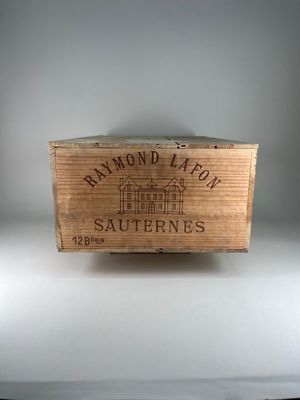 a wooden box with a label on it on a table