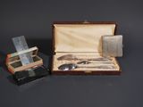 a silverware set in a case with a knife and spoon in it
