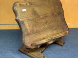 a wooden chair that is sitting on a blue carpet