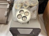 a cupcake pan and a muffin pan on a table