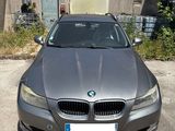 bmw 5 series saloone in a parking lot in front of a building