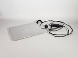 a laptop and headphones on a white surface