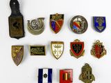 several different types of badges are arranged on a white surface