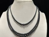 a close up of a necklace on a mannequin mannequin