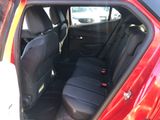 a red car with black seats in the back of it