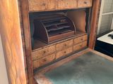 a wooden desk with a drawer underneath it in a room