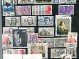 many different types of stamps displayed on a black board