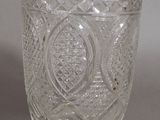 a glass cup that is sitting on a table
