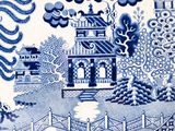 a blue and white plate with a picture of a pagoda on it