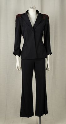 an image of a mannequin wearing a black suit