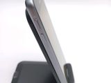 a close up of a cell phone on a cell phone stand