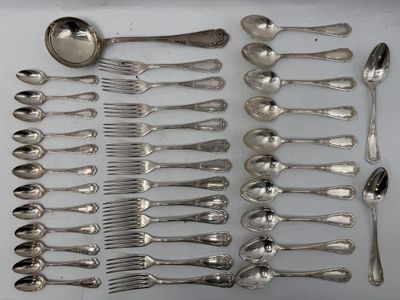 a lot of silver spoons and spoons on the table