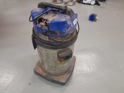 a vacuum that is sitting on the floor in the room