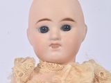 a small doll that is sitting on a table