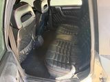 the interior of a car with the door open and the seat up