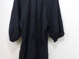 an image of a black dress hanging on a hanger