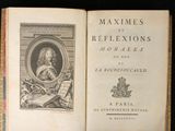 an old book with a picture of a man holding a book