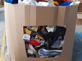 a cardboard box full of shoes on a pallet in a warehouse