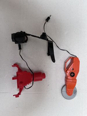 two tools that are laying on the floor next to each other