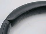 a pair of black headphones on a white surface