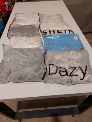 a table that has a lot of bags of food on it