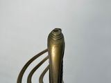 a close up of a metal object on a white surface