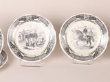 three plates with a picture of a man and a woman on them