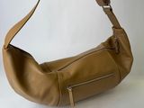 tan leather shoulder bag with zippers and zipper closures