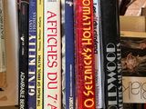 many books that are stacked on top of each other