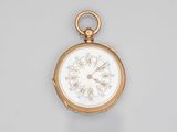 an antique gold pocket watch with roman numerals and roman numerals on the dial