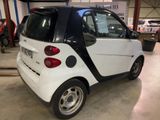 a small car that is parked in a garage