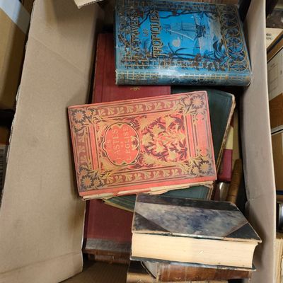 a box full of books sitting on top of a table