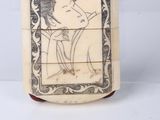 an old wooden box with a picture of a woman on it