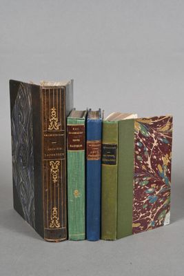 three books that are stacked on top of each other