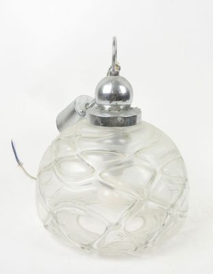 an image of a clear glass ornament with a silver lid