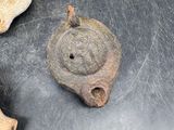 three pieces of pottery sitting on top of a table next to each other